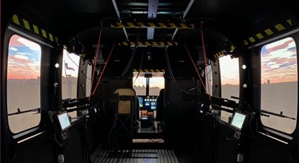 Inside one of the helicopter trainer simulators which can fit a four-person crew.