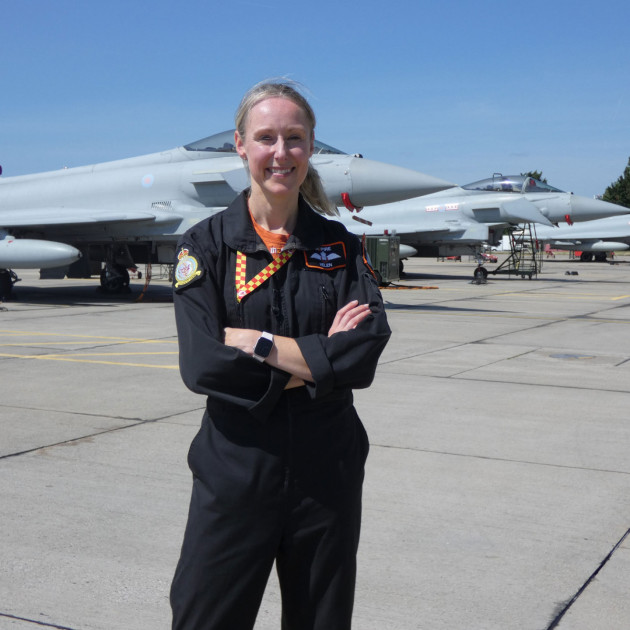 Inzpire staff standing in front of a plane