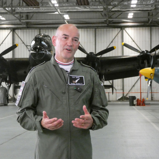 Inzpire staff standing in front of plane