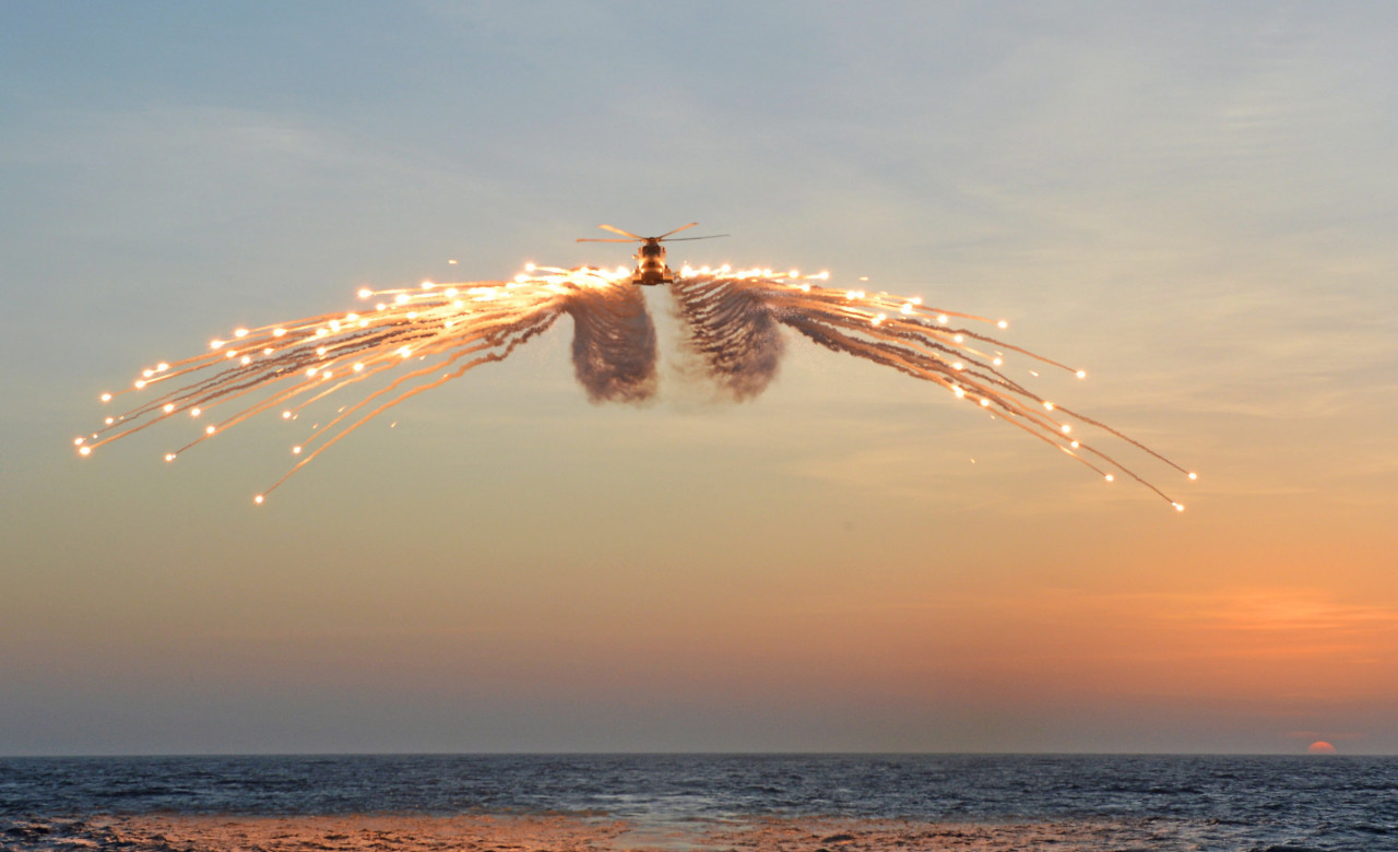 Merlin helicopter releasing decoy flares