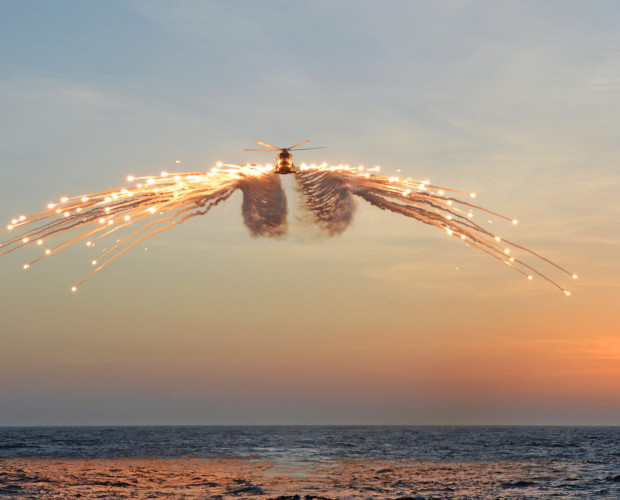 Merlin helicopter releasing decoy flares
