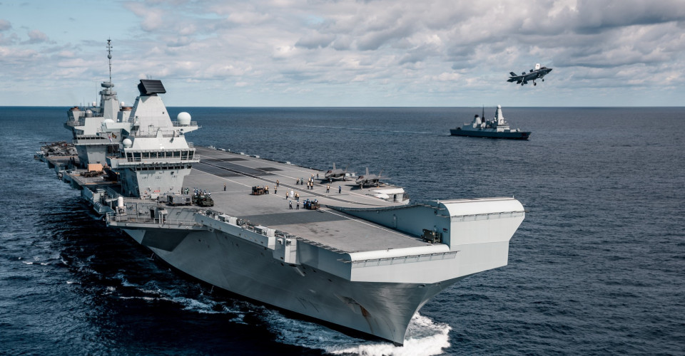 The aircraft carrier HMS Queen Elizabeth and her escort HMS Dragon