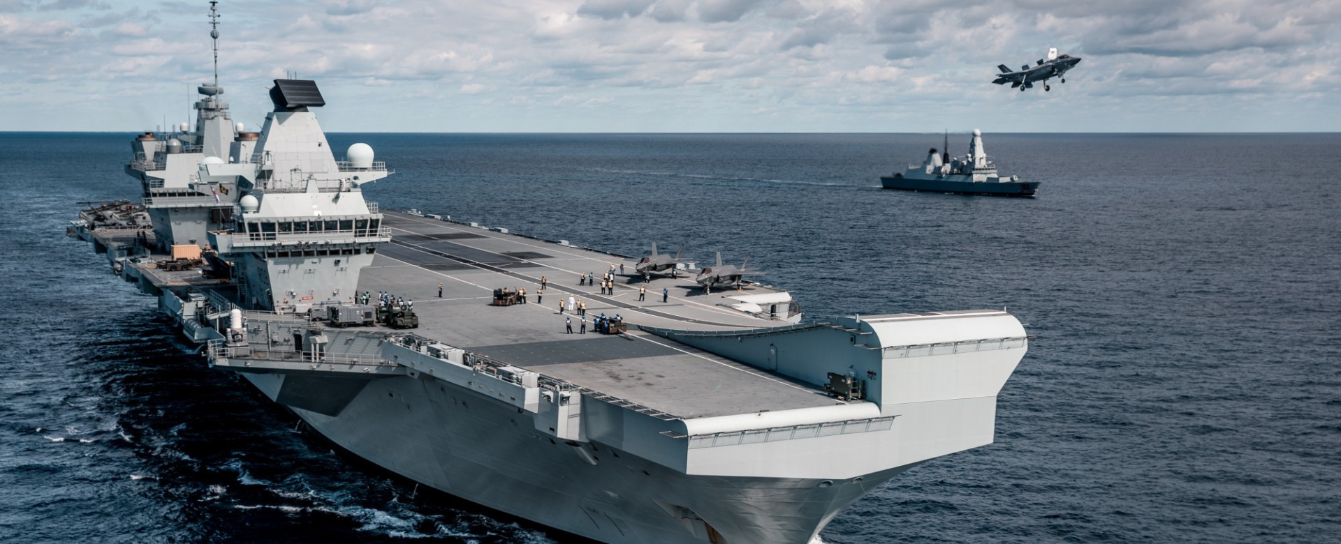 The aircraft carrier HMS Queen Elizabeth and her escort HMS Dragon