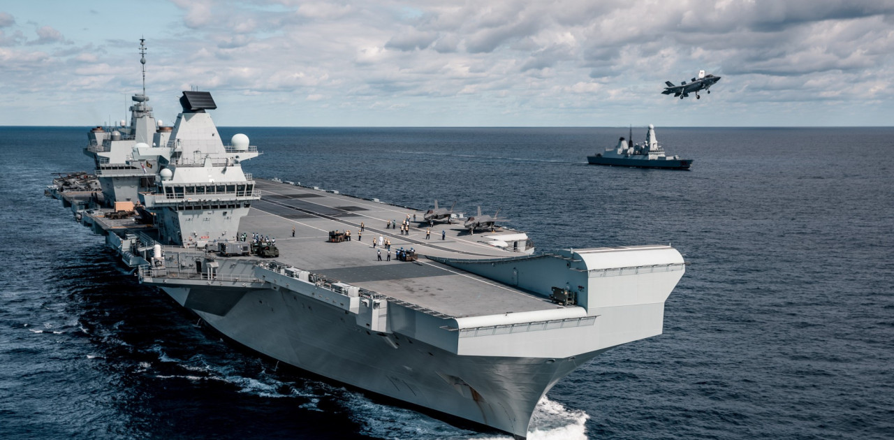 The aircraft carrier HMS Queen Elizabeth and her escort HMS Dragon
