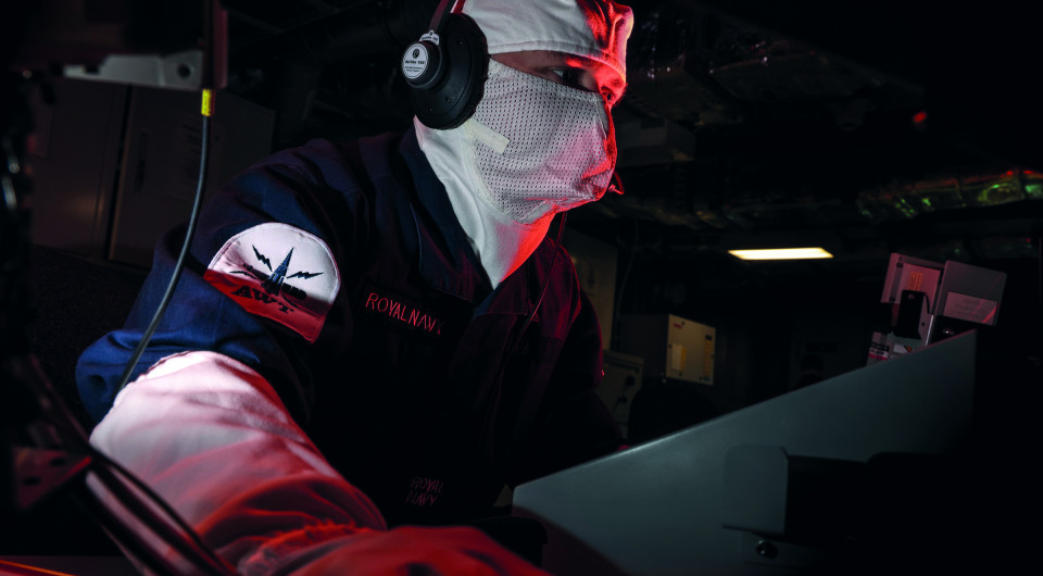 Royal Navy personnel in ship's ops room