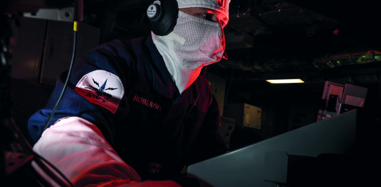 Royal Navy personnel in ship's ops room