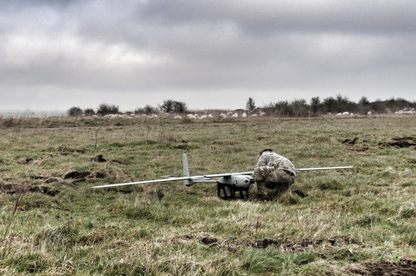A member of the British Army conducts pre-flight checks on the EAGLE VXE30 drone